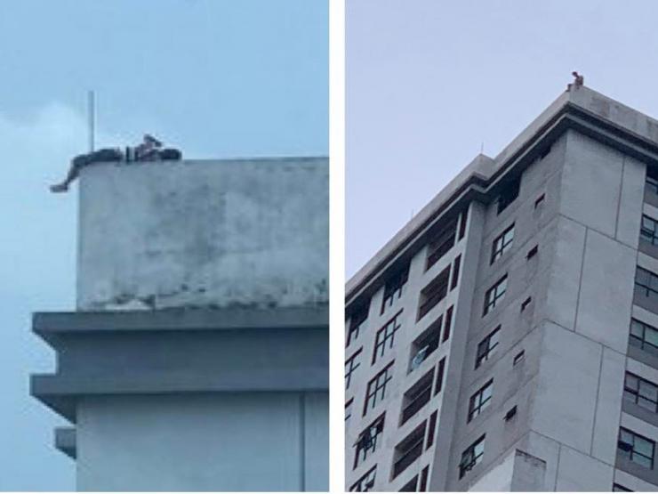 Người đàn ông nằm vắt vẻo, la hét trên nóc chung cư cao tầng ở Hà Nội